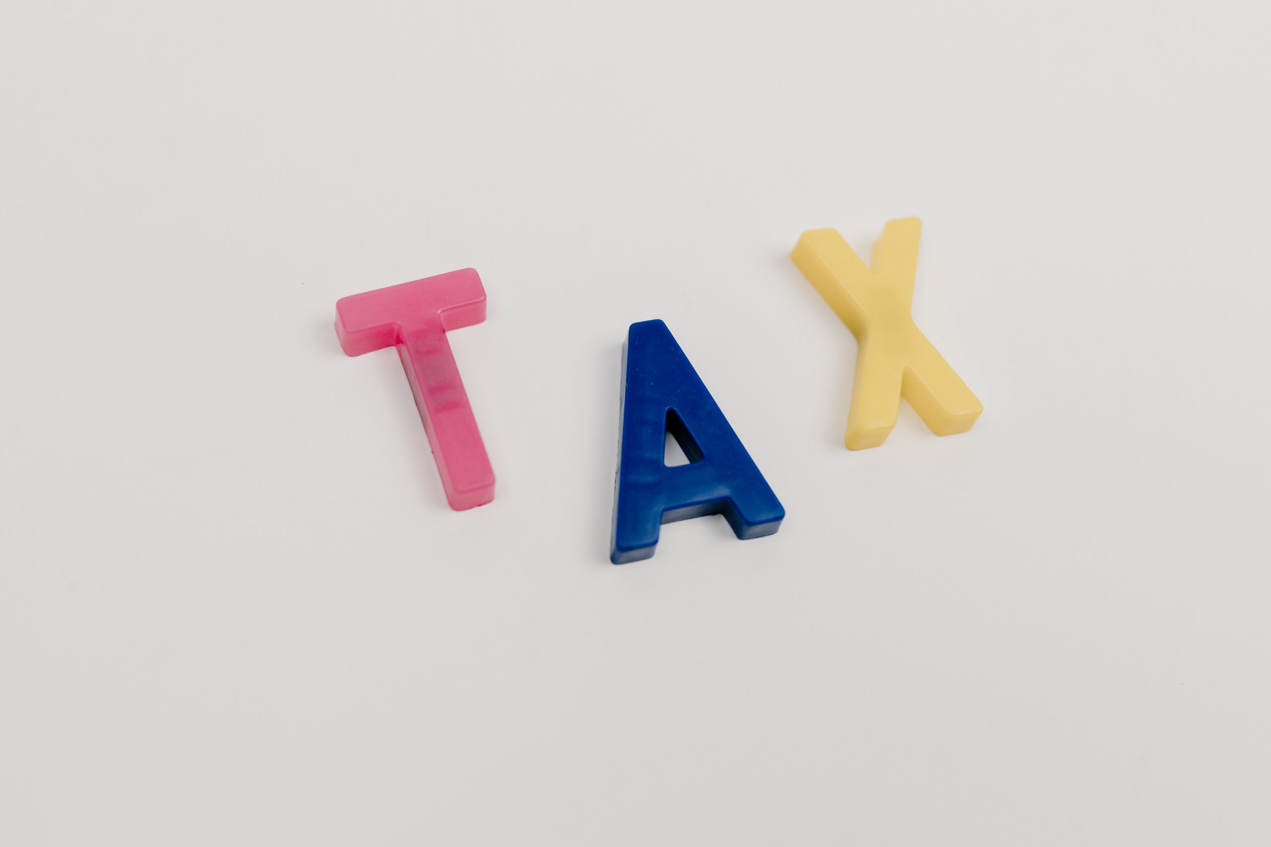 Image of 3 letters spelling the word tax